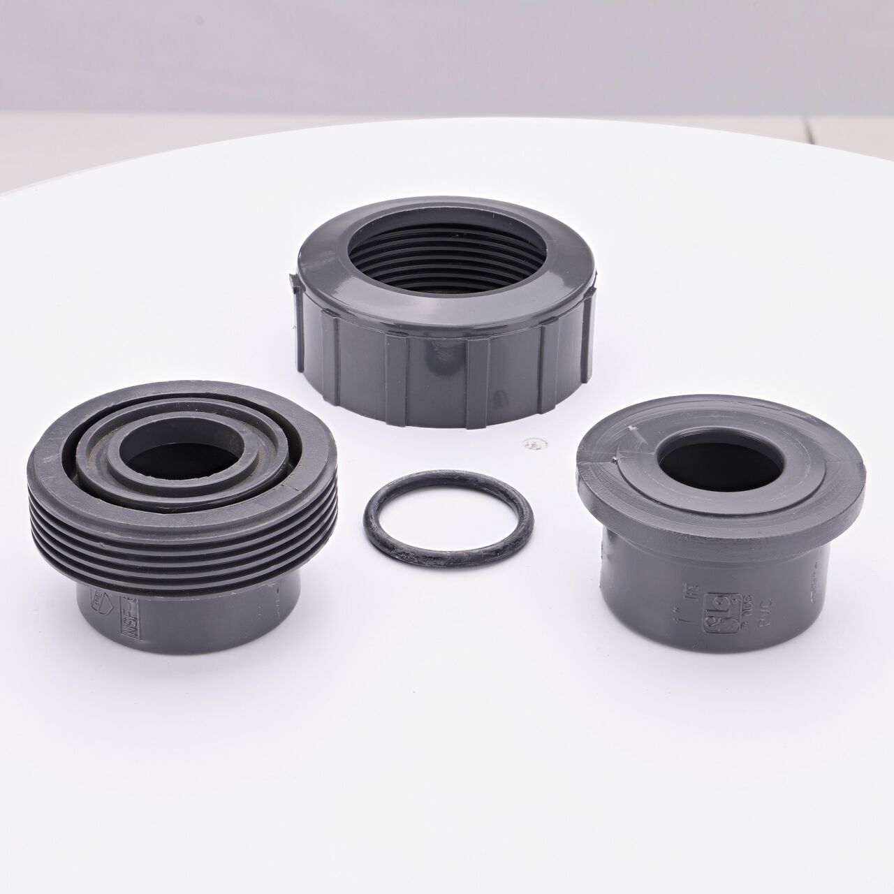 NDS PVC Union Ball Valve unassembled showing all the pieces including the Slip ends facing upwards that connect two 1 in. Sch. 80 pipes