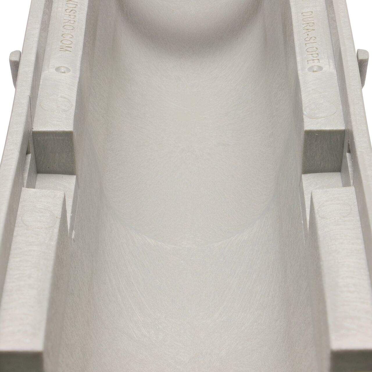Closeup view of the grooved interior on the NDS Dura Slope 4.34 Deep Neutral Channel Drain, which supports and secures grates with the grate locking system (NDS DS-091N, NDS DS-092, NDS DS-093, NDS DS-094)