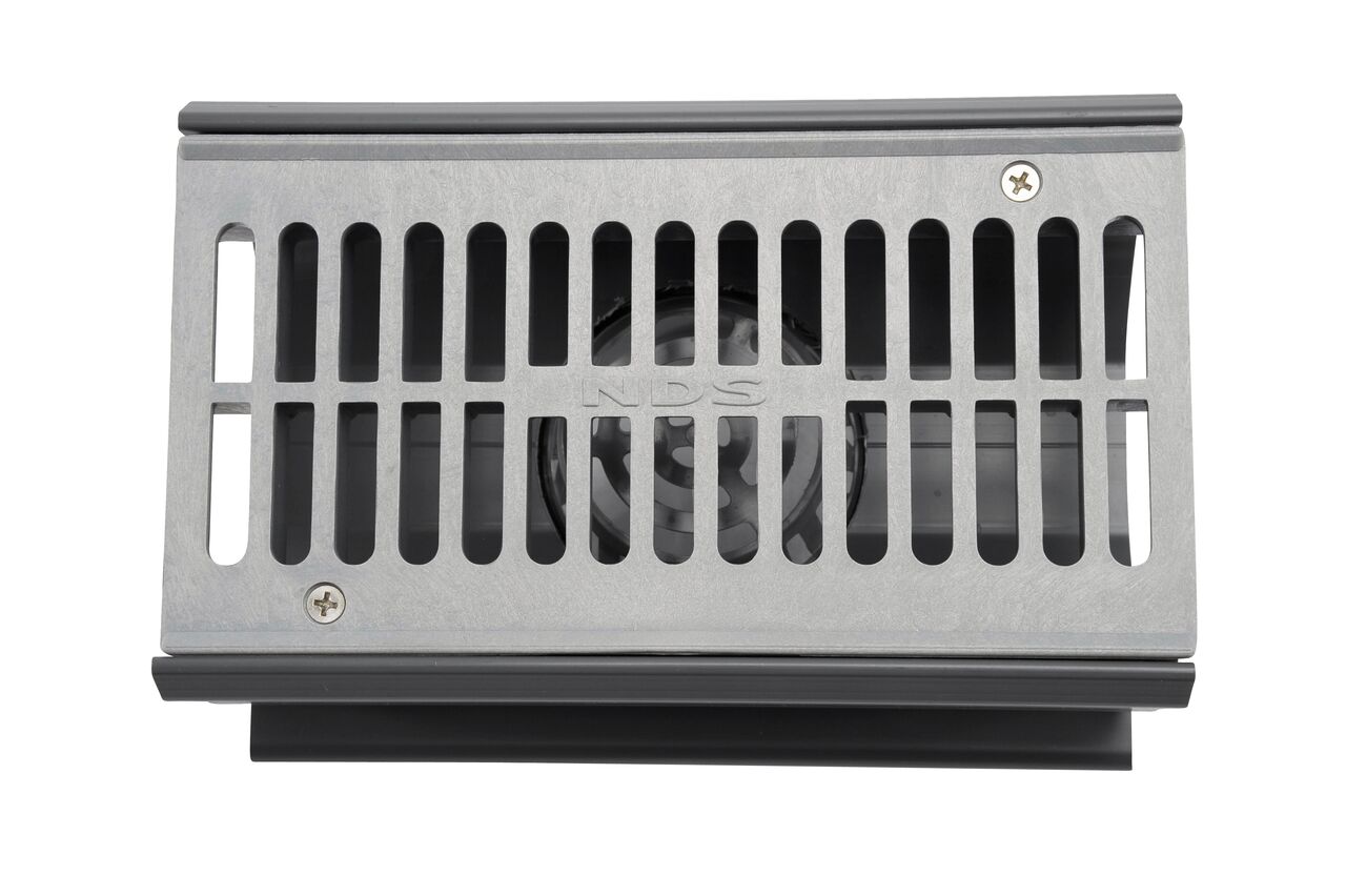 See the grate design and the bottom pipe connection of the Spee-D® Channel Drain Bottom Outlet Assembly which works with the Spee-D Channel Drain System and connects to drainage pipe in the bottom of the drain (NDS 2351*, NDS 2351)