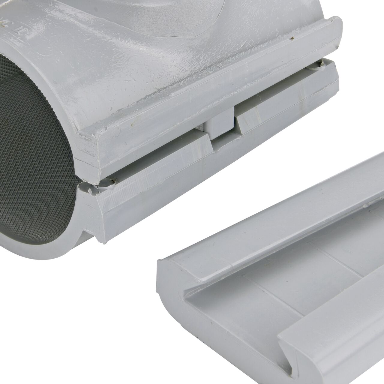 Closeup view of the patented wedge which unconnects on the 2 in. NDS Flo-Tap™ Rigid PVC saddle with 3/4 in. socket or 1 in. spigot for easy installation (NDS 3120)