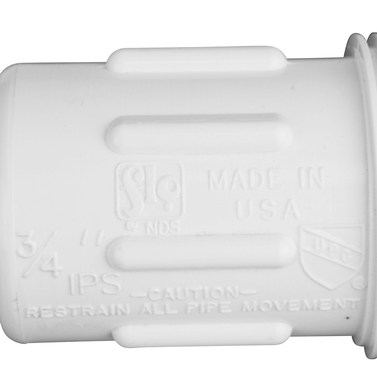 Closeup view of the NDS PVC Compression Adapter, 3/4 in. IPS UC X 3/4 in. IPS MPT showing that it is made in the USA as part of a complete flow management system for pool, spa, irrigation, and plumbing applications (NDS CPA-0750)