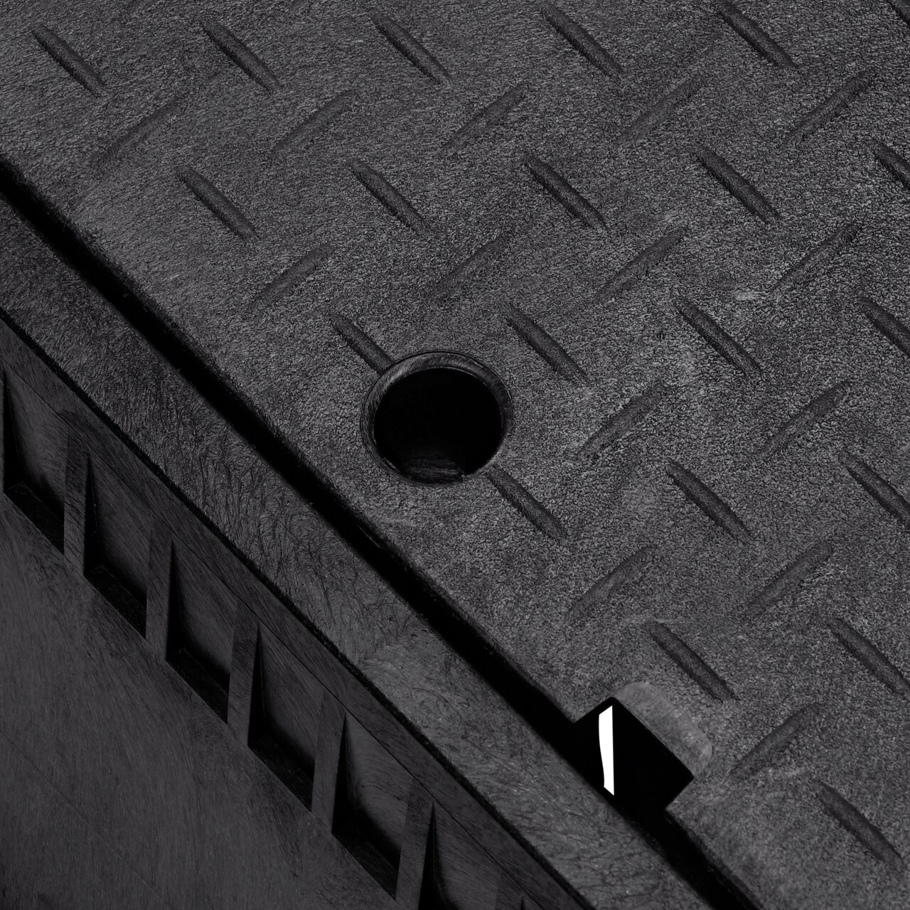 The drop-in meter box lid securely in place on the NDS 13 in. X 20 in. Rectangular Standard Series Black Meter Box and Black Water Meter Cover (NDS D1500-DISB) keeping components protected against the elements, foot traffic, lawn care equipment, and potential vandalism while keeping them out of sight