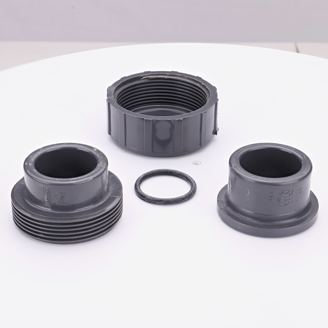 The NDS 1 in. PVC Union shown here unassembled, includes the EPDM O-ring that is placed in the center of the union to create a leak-resistant seal (NDS U2-1000-S)