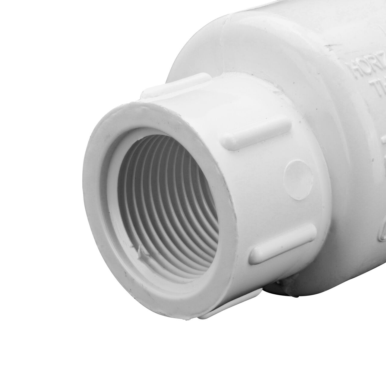 Closeup of the outlet end of the NDS White 3/4 in. female end by female end PVC Swing Check Valve (NDS 1520-07F) which prevents backflow in pipelines