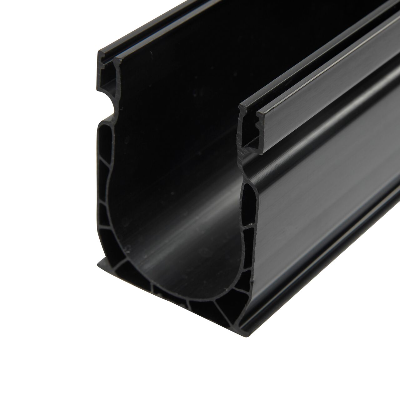 Closeup view of the end of the Slim Channel™ Drain (NDS 9206) which captures light flows from pool & spa decks, patios, walkways