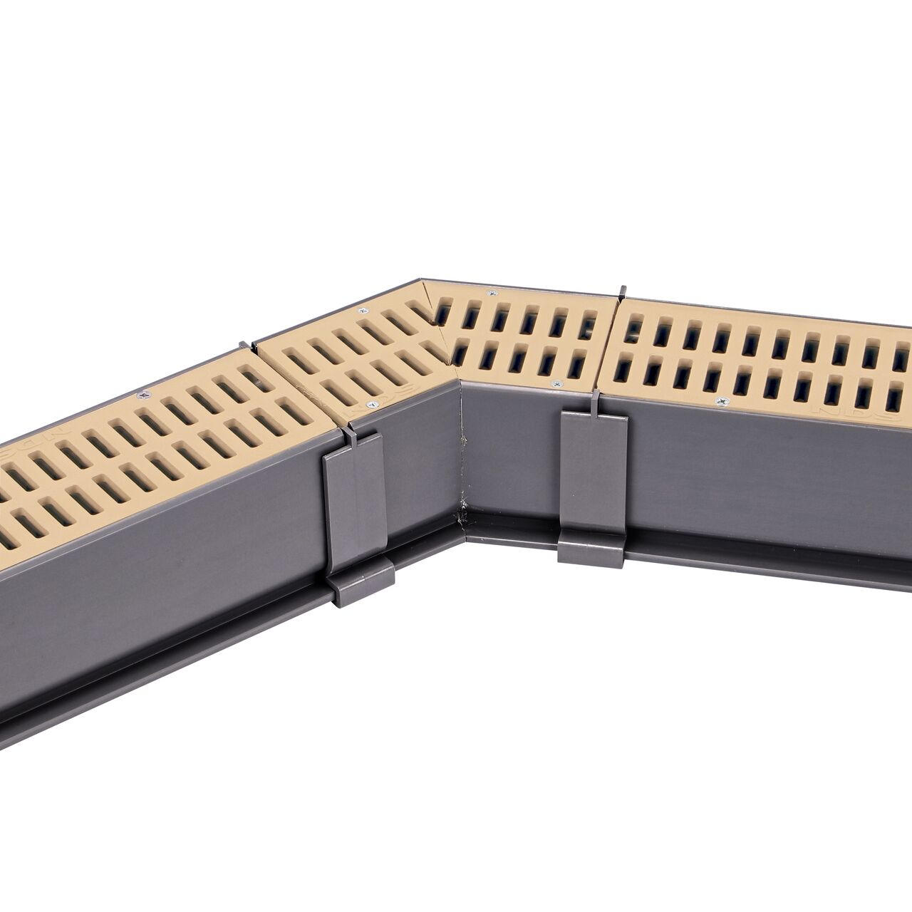 Fully installed NDS Sand Mini Channel™ Drain 45 Degree Elbow and Grate (NDS 5303) with couplers and channel drains with grates