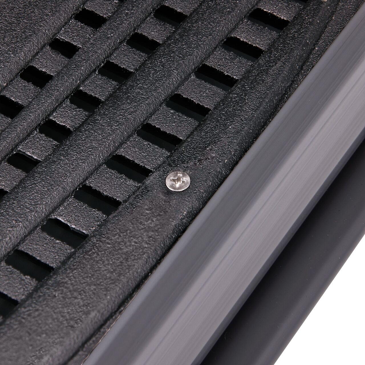 Closeup of #8 X 1 in. Phillips Flat Head Screw securing cast iron grate to Spee-D Channel (NDS 229)