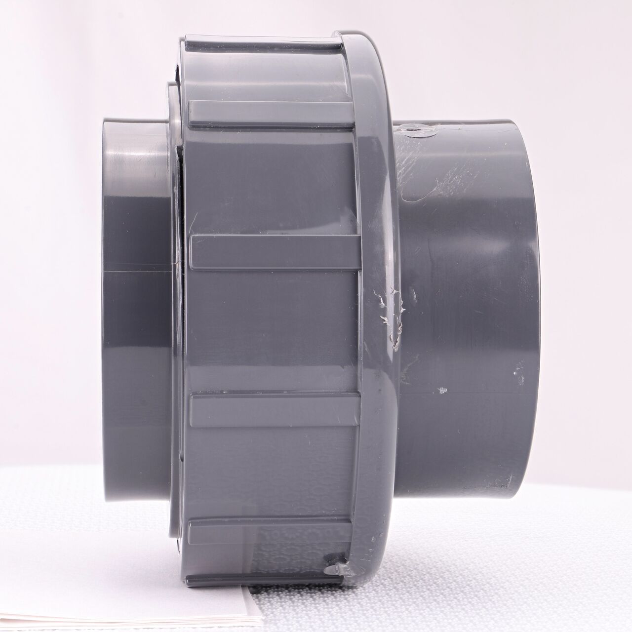 Side view of the NDS 3 in. PVC Union (NDS U-3000-S) shows both slip ends and a pull-apart feature to quickly disconnect from pipes