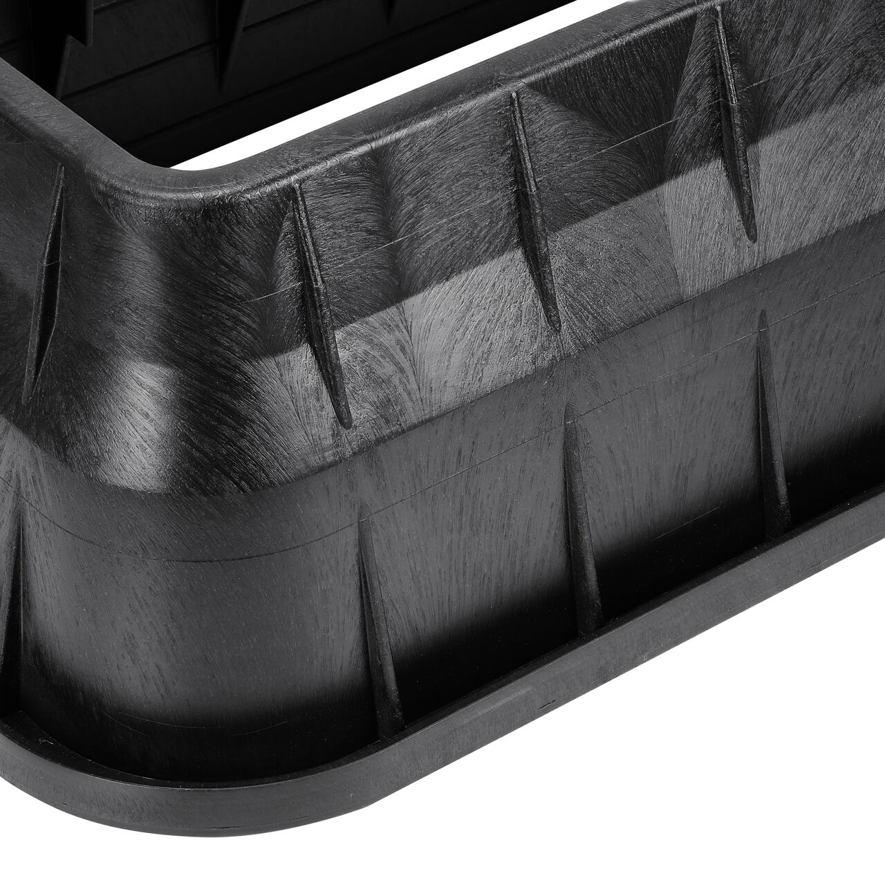 Closeup view of the pipe hole on the Black NDS 13 in. X 24 in. Rectangular Standard Series Meter Box (NDS 121BCDMB) for water and irrigation pipe connections