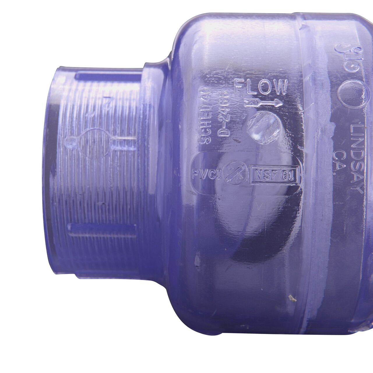 Closeup of the arrow showing water flow direction on the NDS Clear 2 in. female end by female end PVC Swing Check Valve (NDS 1520C20F)