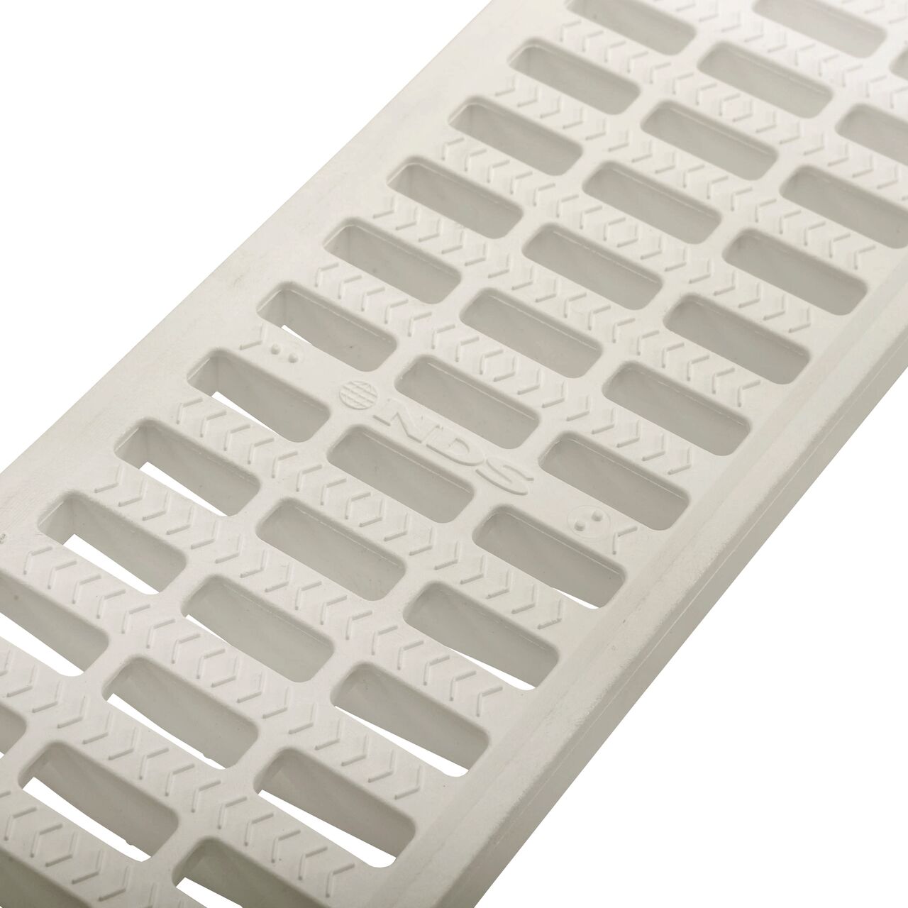 Angled Closeup of grate openings on NDS 5 in. Pro Series Channel Drain Grate in White Plastic (NDS 819)