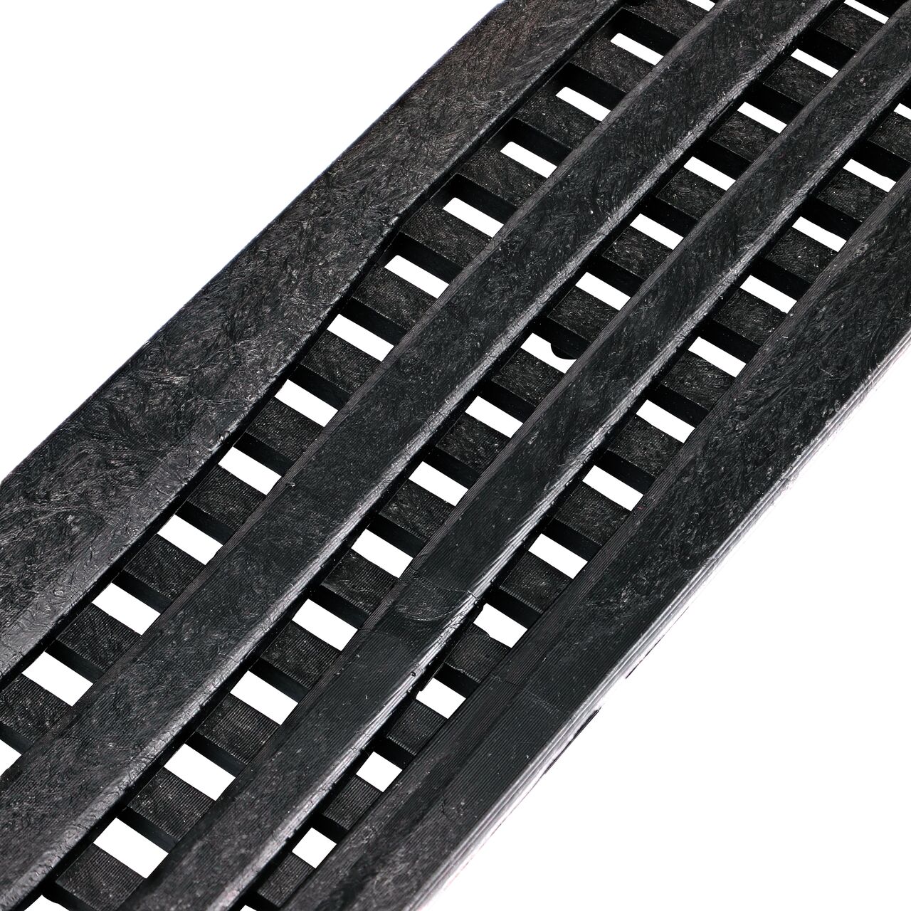 Closeup Angled View of the Decorative Wave Black Plastic Mini Channel™ Drain Grate (NDS 555)