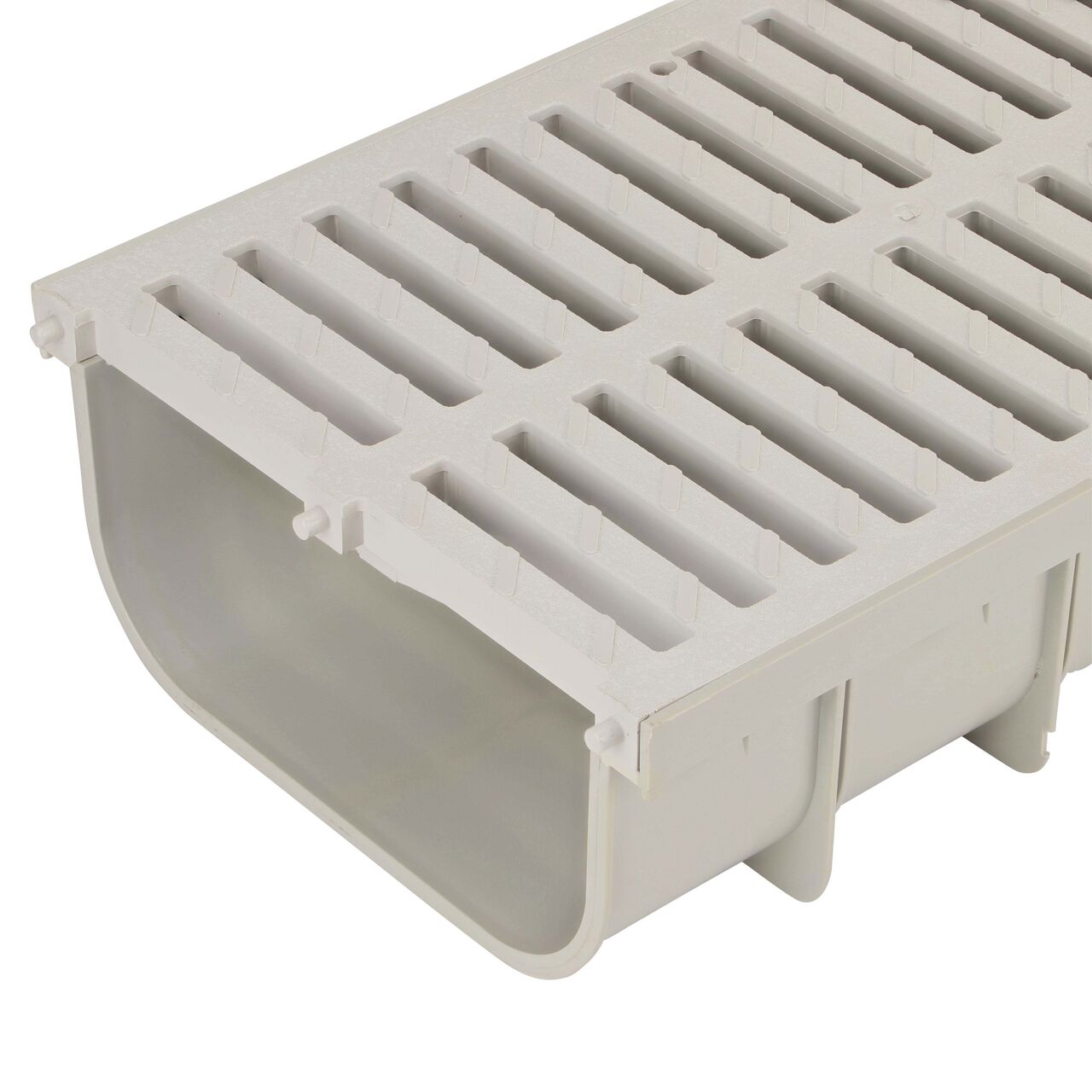 Closeup of the 12 in. Pro Series Channel™ Drain, Shallow Profile (NDS 840) with the Light Gray Grate installed (NDS 847)