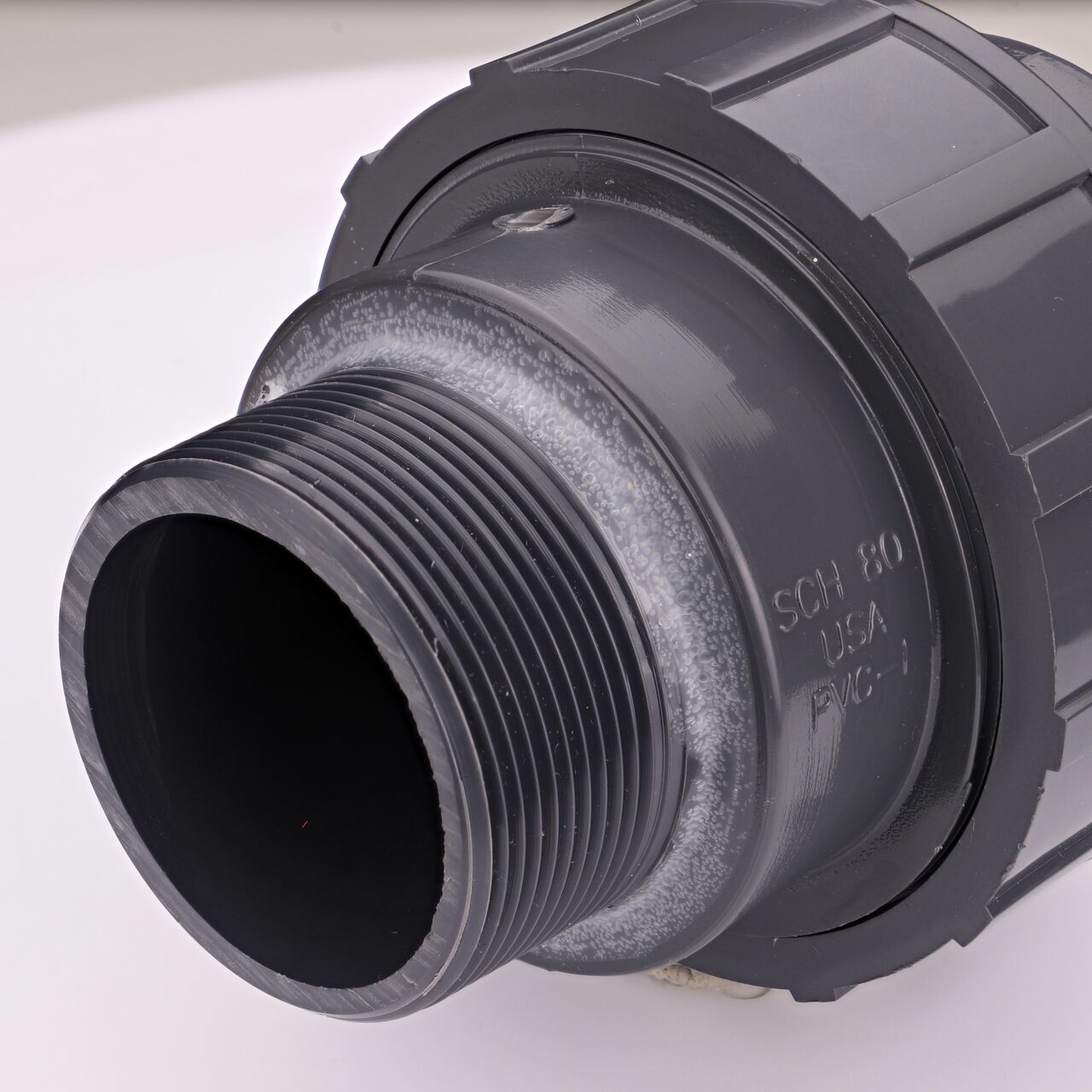 Closeup view of the MPT threaded end on the NDS 2 in. PVC Union (NDS U-2000-SM) which provides a corrosion-free connection between pipes and prevents costly property damage