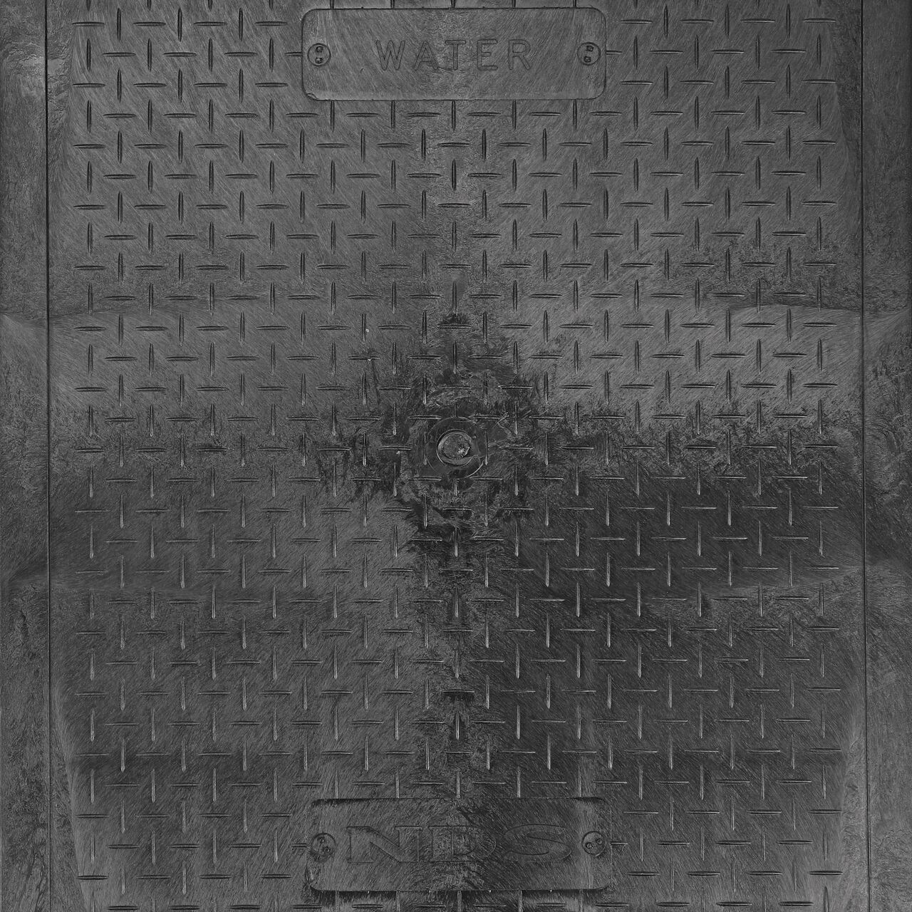 Closeup view of the Water markings on the Black Water cover for the NDS 13 in. X 20 in. Rectangular Standard Series Valve Box (NDS 117BCW)