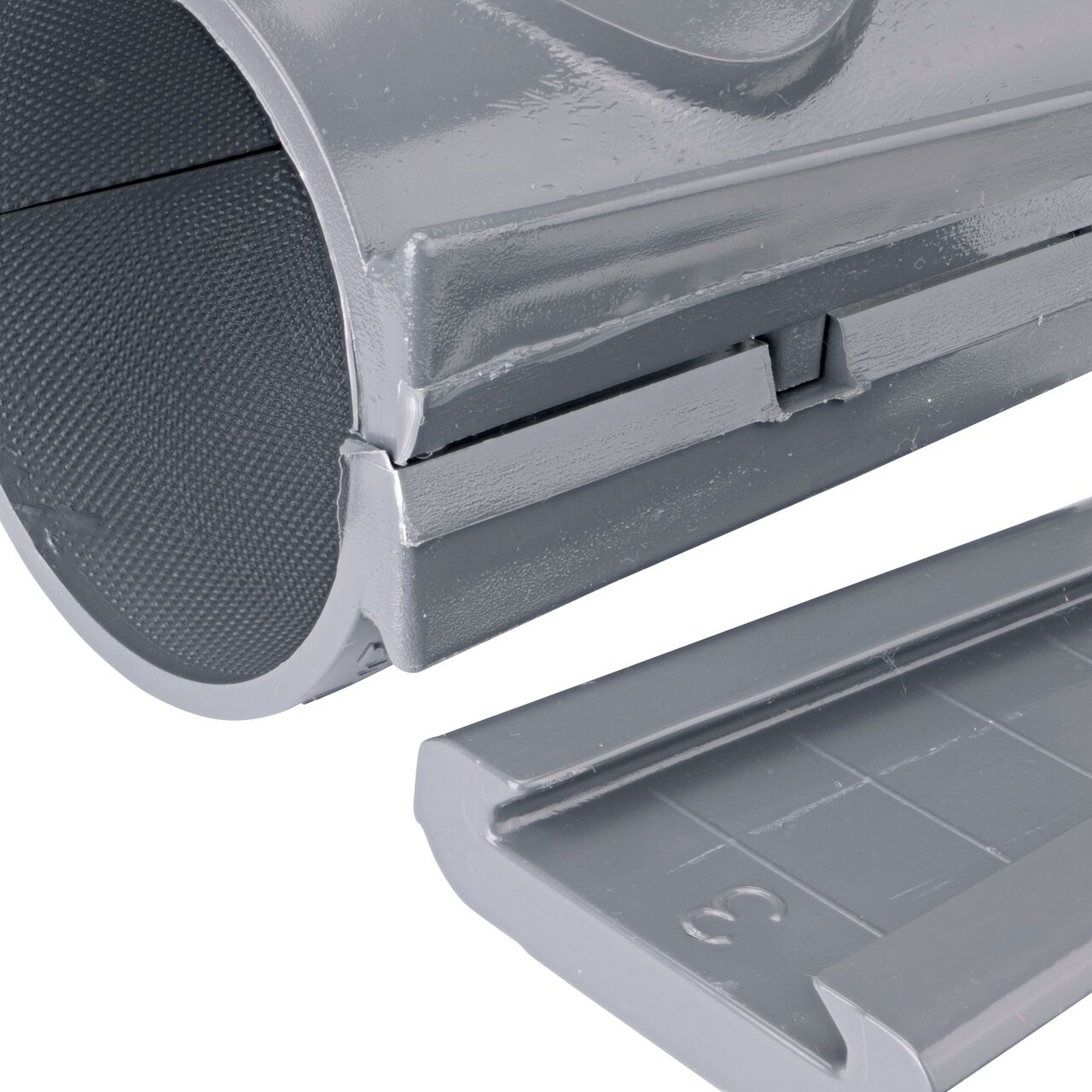 Closeup of the wedge latch uninstalled on the NDS Clamp-It™ Rigid PVC Saddle with 3/4 in. FPT connection on top (NDS 443007) for 3 in. PVC pipe