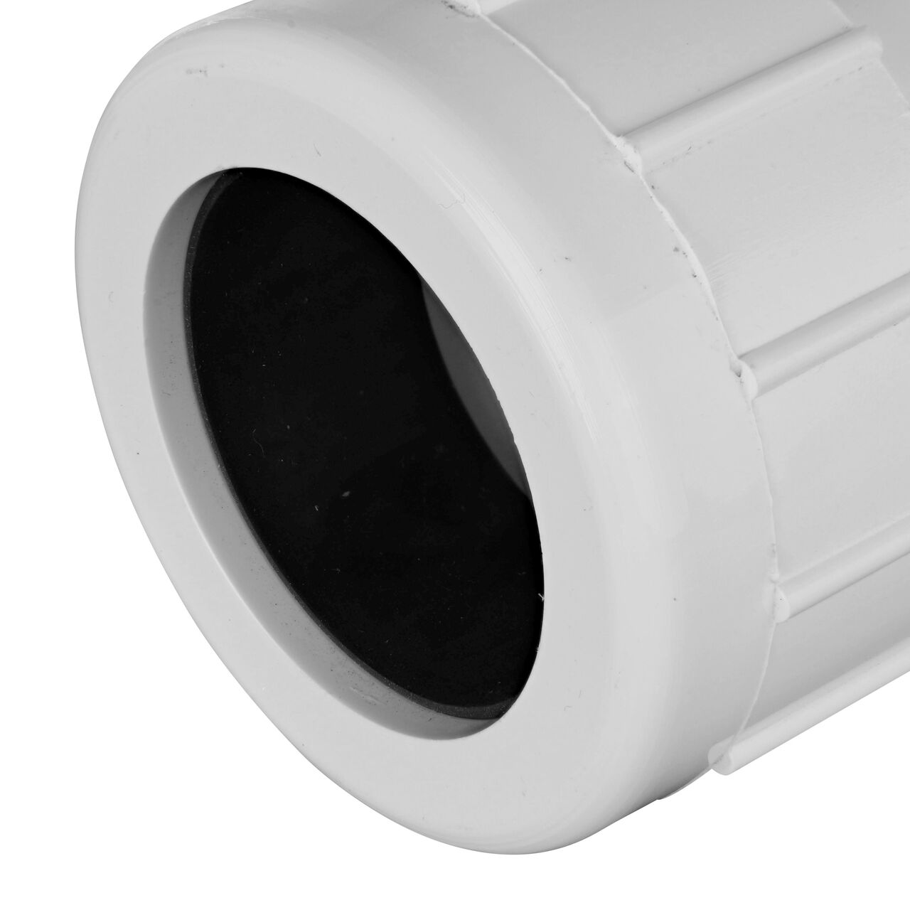Closeup view of the NDS IPS UC Compression Coupling showing the 1-1/2 in. compression end with adjustable nut secured which reduces pull-out from pipe (NDS CPC-1500)