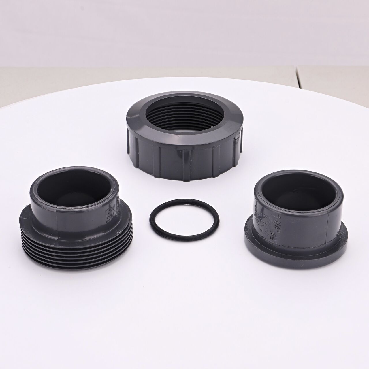 The NDS 1-1/4 in. PVC Union shown here unassembled, includes the EPDM O-ring that is placed in the center of the union to create a leak-resistant seal (NDS U-1250-S)