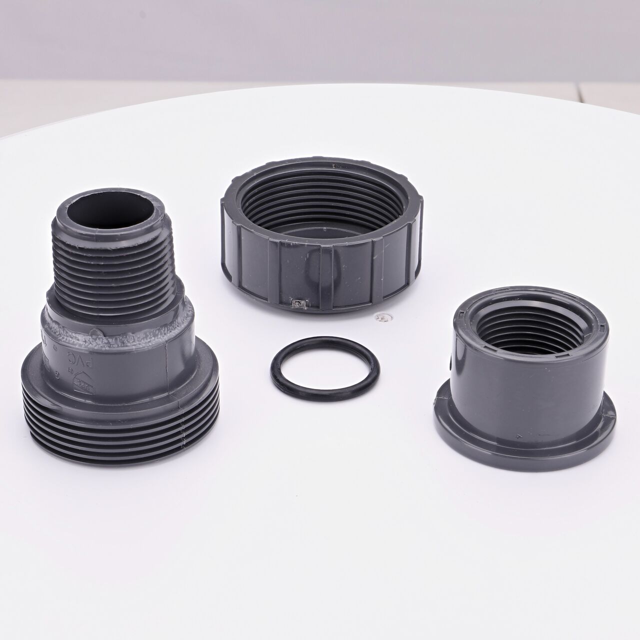 NDS PVC Union, 1 in. Sch. 80 FPT X MPT shown here unassembled includes the EPDM O-ring that is placed in the center of the union to create a leak-resistant seal (NDS U-1000-TM)