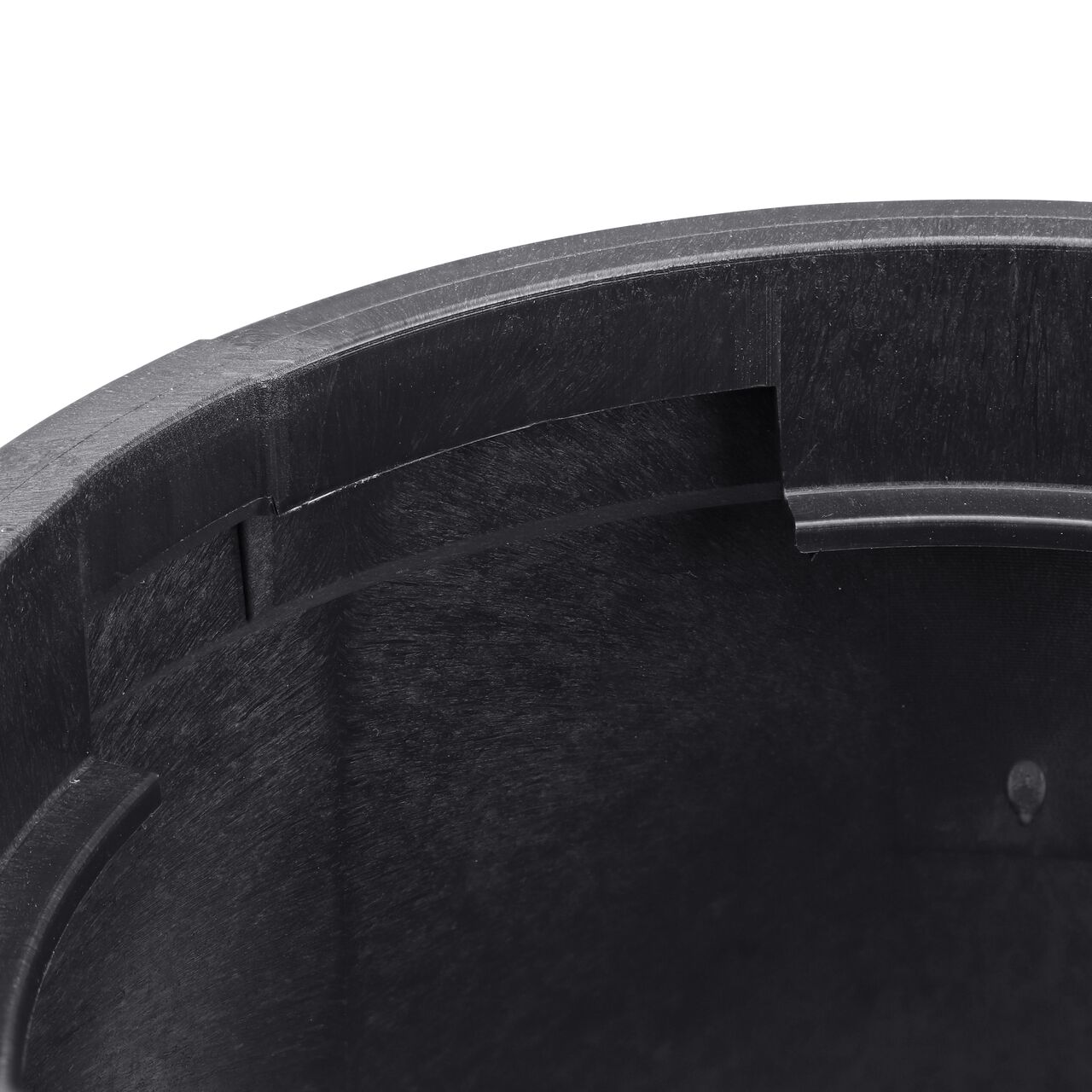 Closeup view of the locking lip that the valve box lid secures in when twisted to a locked position, showing the part to unlock the lid to access the inside on the black NDS 6 in. Round Standard Series Valve Box (NDS 2107BC)