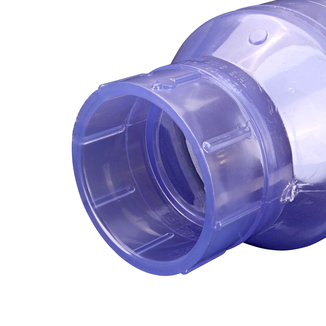 Closeup of the outlet end of the NDS Clear 3 in. slip end by slip end PVC Swing Check Valve (NDS 1520C30) which prevents backflow in pipelines