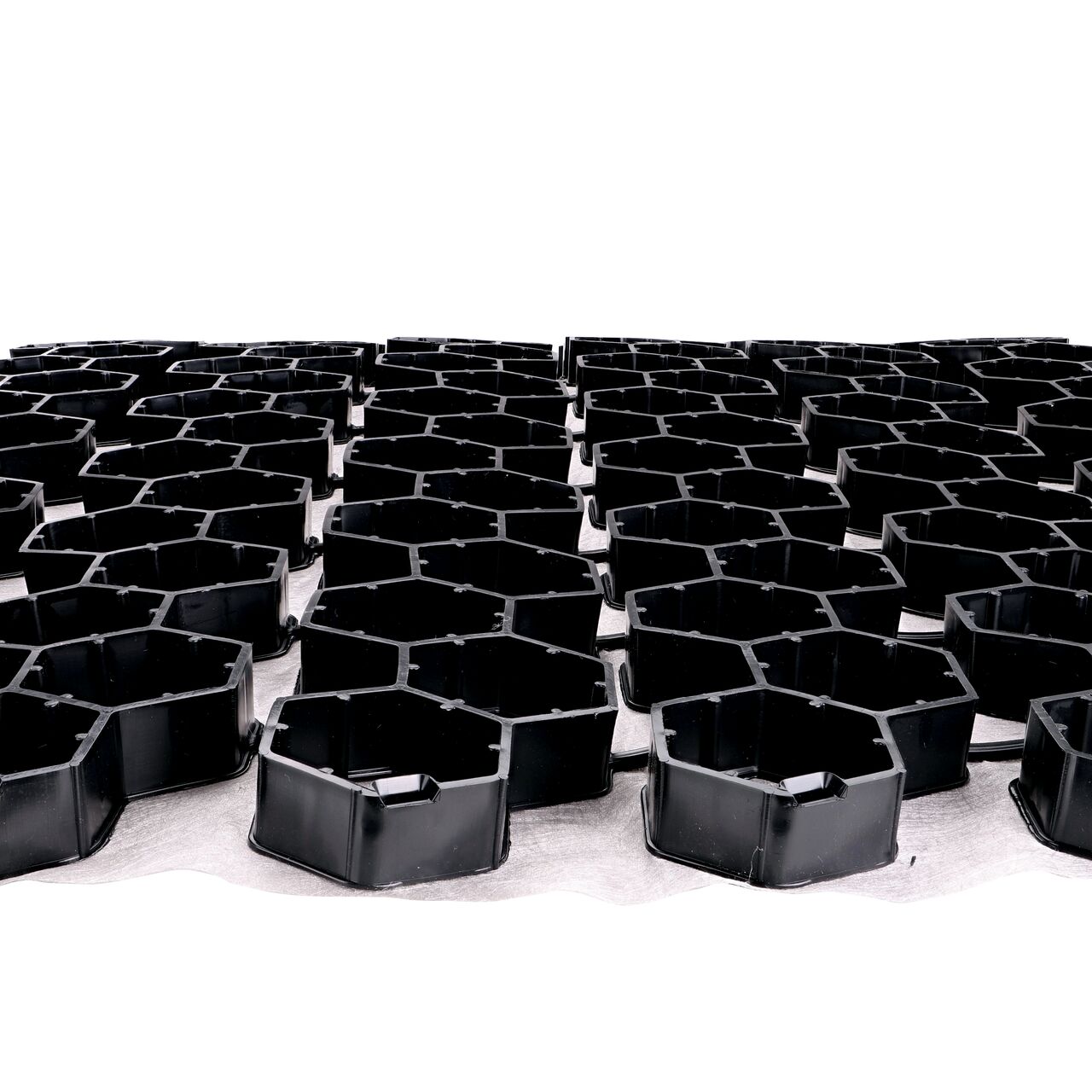 Lay two Black NDS EZ Roll® Gravel Paver rolls side by side to use the locking tabs which snap in the open grooves for a quicker, easier installation; no tools required