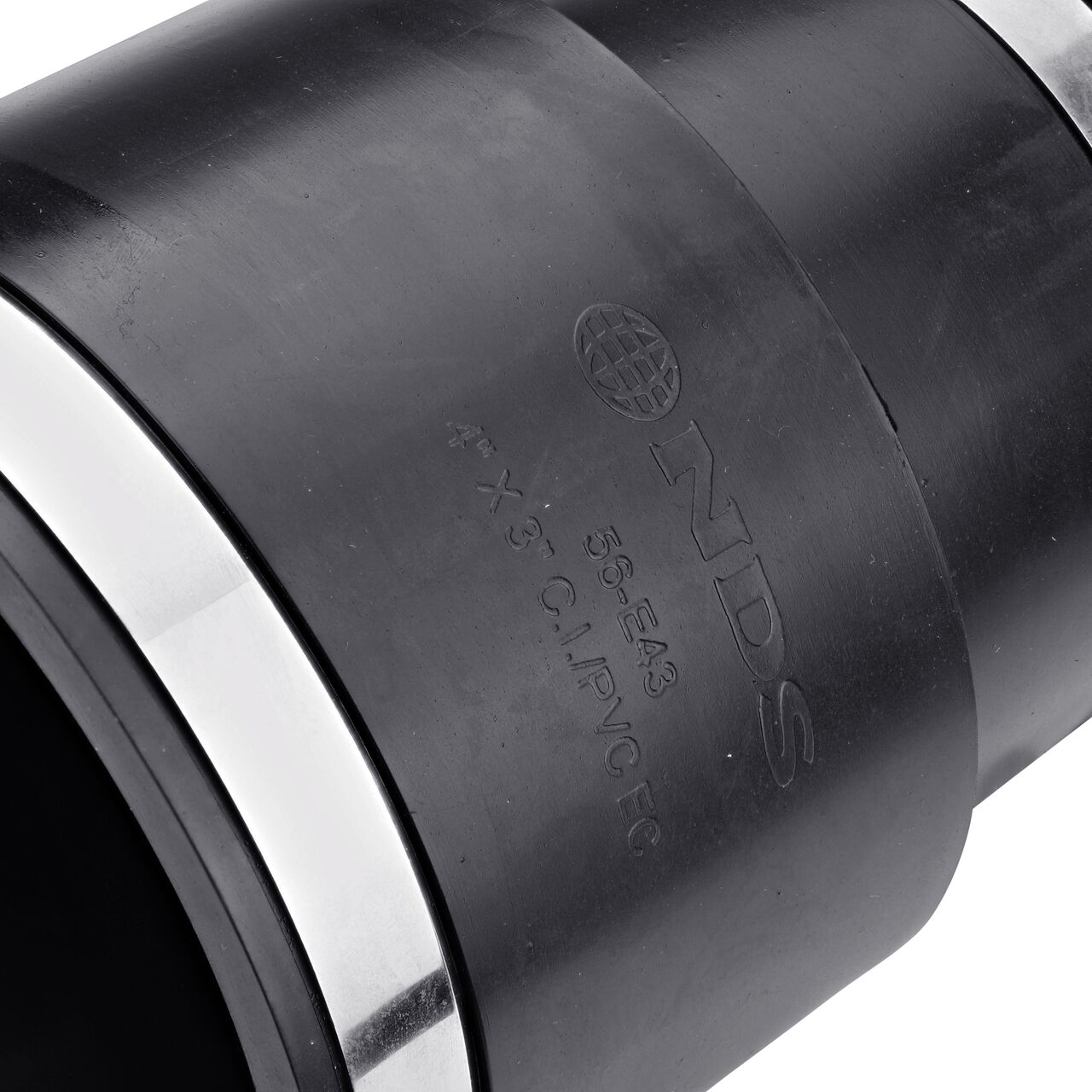 Closeup view of the NDS 4 in. X 3 in. flex eccentric coupling mark showing the size and compatible cast iron/sewer and drain or DWV/copper/steel/lead pipes eliminating guesswork on the job (NDS 56-E43)