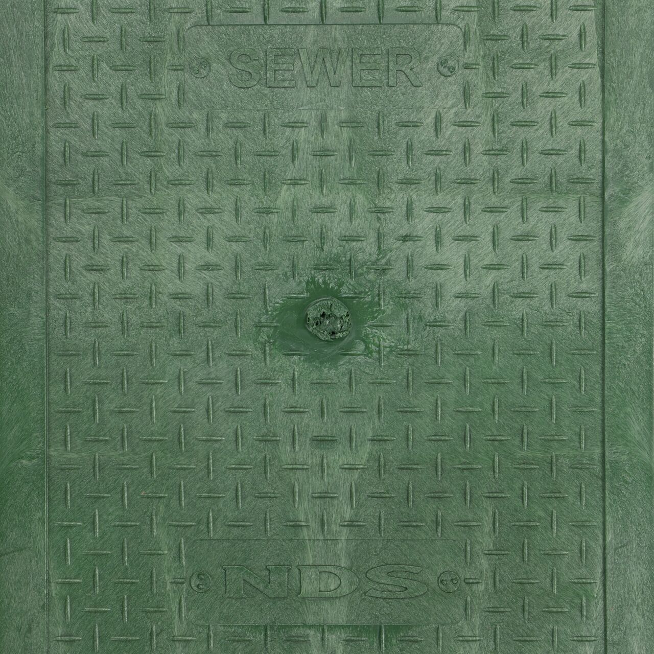 Closeup view of the Water markings on the Green Sewer Water cover for the NDS 14 in. X 19 in. Rectangular Standard Series Valve Box (NDS 113CS)