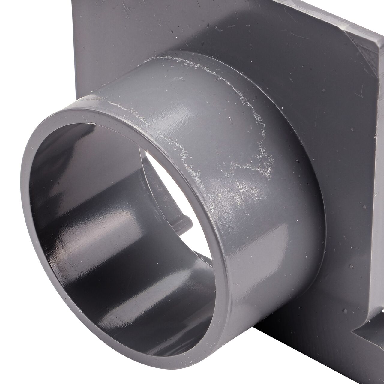 Closeup of the circular opening of the The NDS Gray Mini Channel™ Drain End Outlet (NDS 546)
