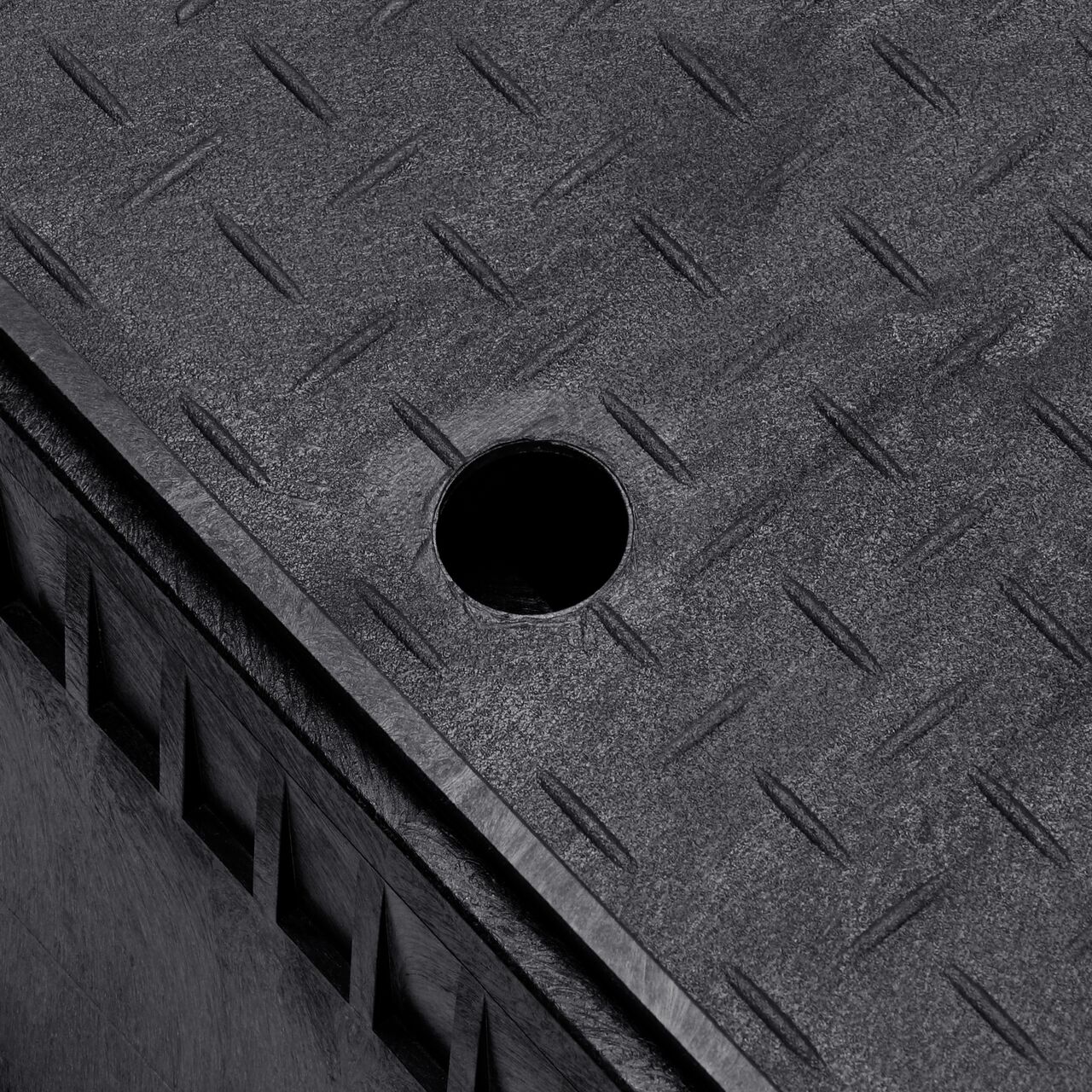 The drop-in meter box lid securely in place on the NDS 13 in. X 20 in. Rectangular Standard Series Black Meter Box and Black Water Meter Cover with plastic reader door (NDS D1500-OLSB) keeping components protected against the elements, foot traffic, lawn care equipment, and potential vandalism while keeping them out of sight