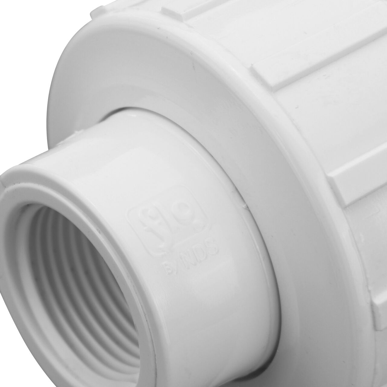 Close up view of the PVC Union, 3/4 in. Sch. 40 FPT X FPT showing NDS brand a leader in flow management solutions and the preferred choice of professionals since 1972 mark (NDS WU-0750-T)