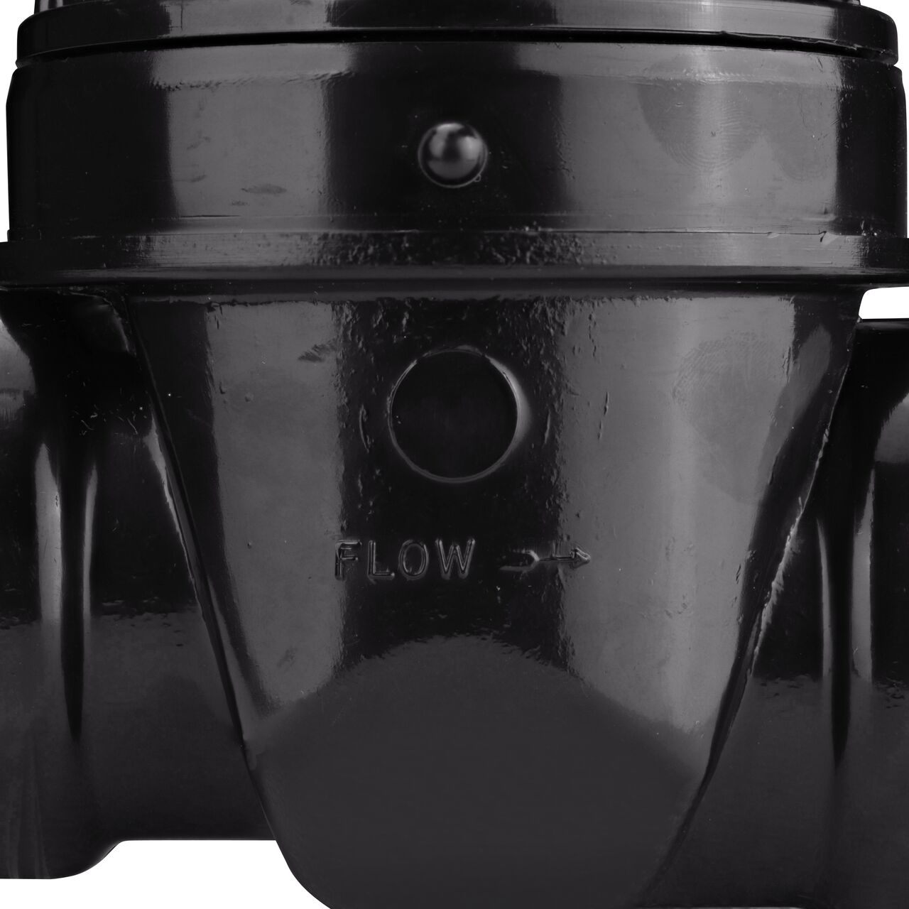 Closeup of the outside part of the NDS 2 in. Backwater Valve with stamped arrow showing the direction in which the water will flow (NDS 275)