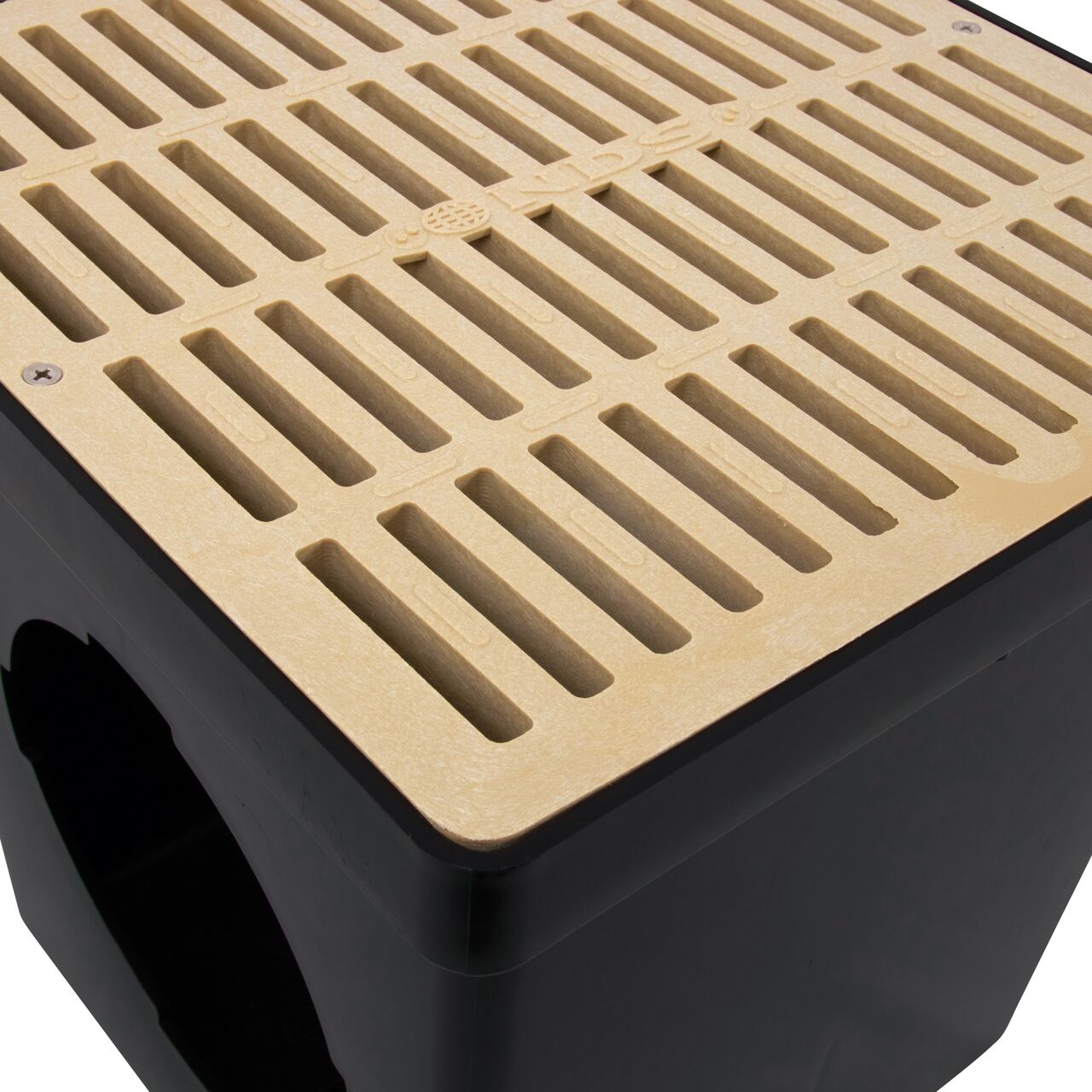 Closeup view of the NDS 12 in. Sand Square Catch Basin Grate (NDS 1212S) on a Retail NDS 12 in. Catch Basin (NDS 1200*)