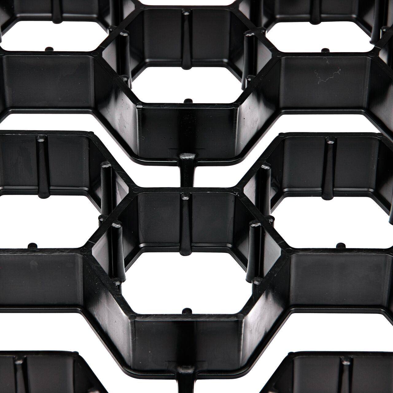 Closeup view of the interconnected hexagonal cells with shared walls which protect the root zone and prevent soil compaction that would inhibit healthy root growth
