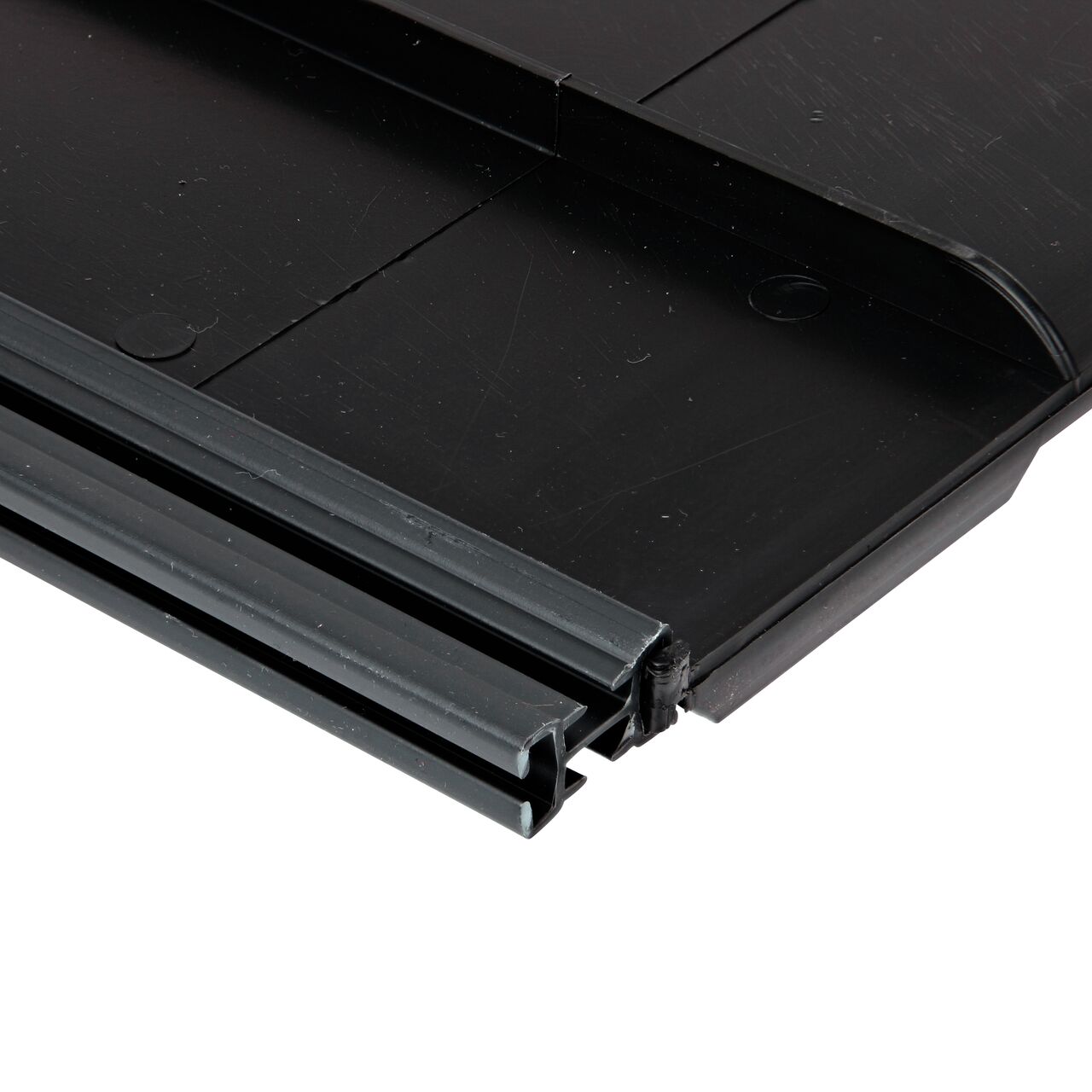 Meta to Closeup of the NDS root barrier Quad Clip™ Joiner Strip to connect panels for easy installation (NDS EP-1250, NDS EP-1850, NDS EP-2450, NDS EP-3650)