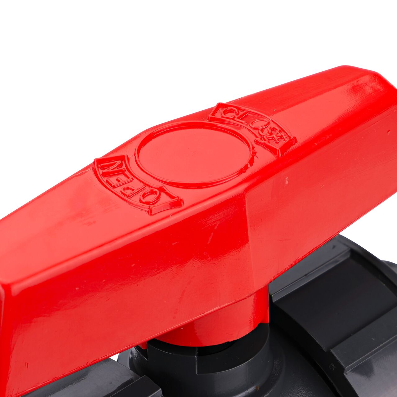 Closeup up view of the markings on the handle on the 1-1/4 in. PVC Slip & Threaded True Union Ball Valve (NDS BTU-1250-E) includings size and open and close.