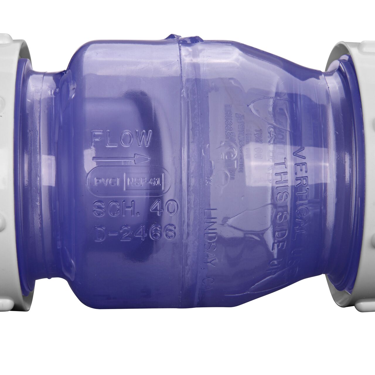 Closeup of the arrow showing water flow direction on the NDS White 1-1/2 in. IPS leak resistant PVC True Union Swing Check Valve (NDS  1720C15)