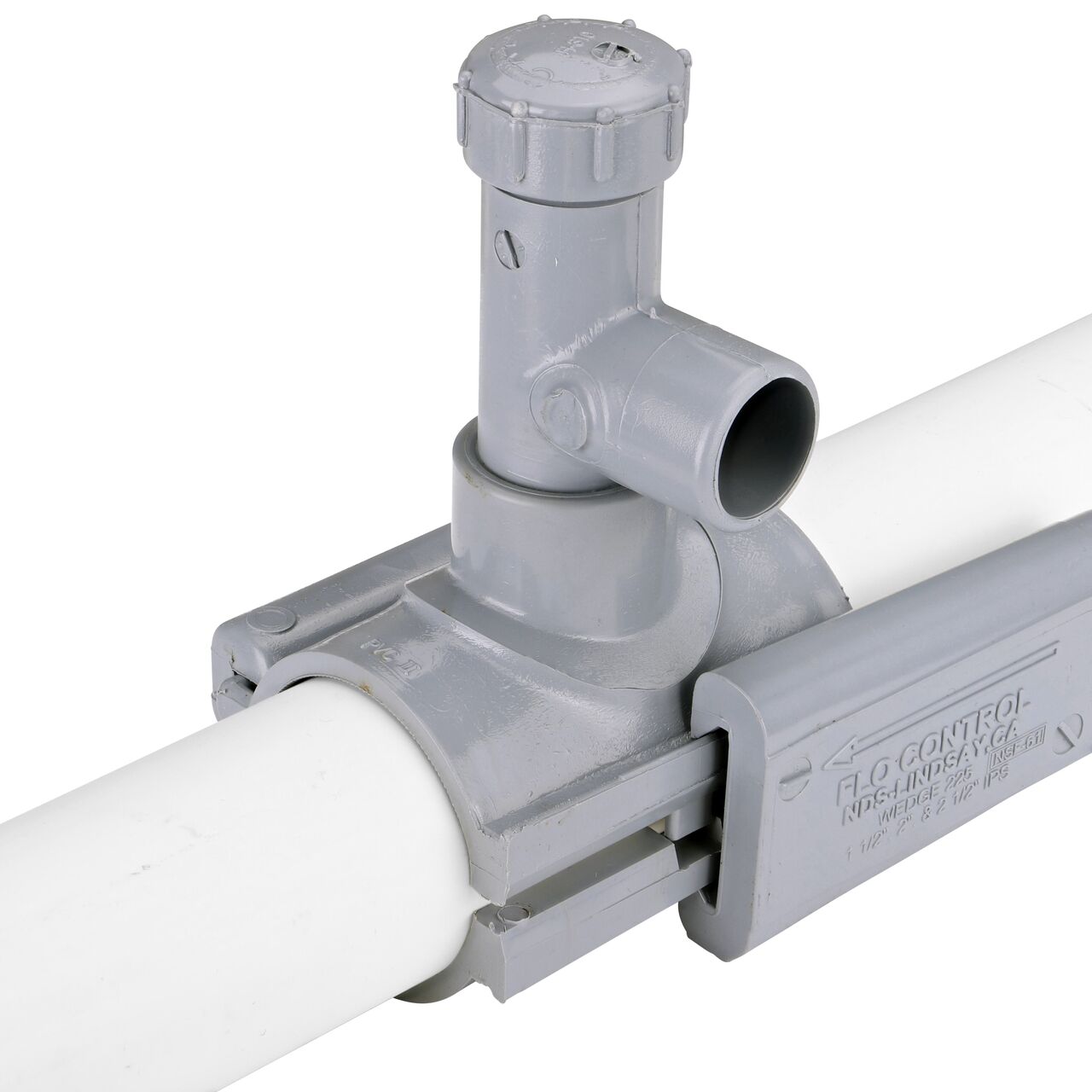 Tap wedge on the 2 in. NDS Flo-Tap™ Rigid PVC saddle with 3/4 in. socket or 1 in. spigot into place to securely lock onto pipe (NDS 3120)