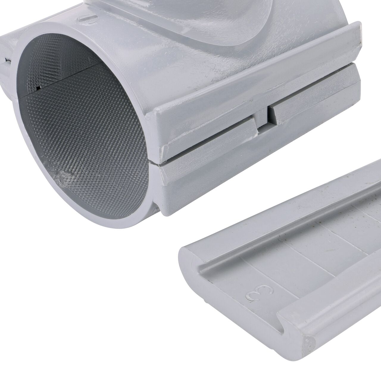 Closeup of the wedge latch uninstalled on the NDS Clamp-It™ Rigid PVC Saddle with 2 in. FPT connection on top (NDS 443020) for 3 in. PVC pipe