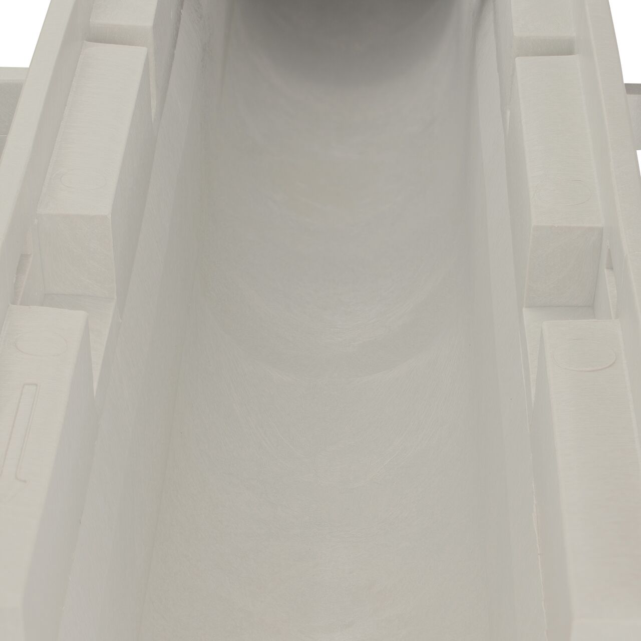 Closeup view of the grooved interior on the NDS Dura Slope Channel Drain, which supports and secures grates with the grate locking system (NDS DS-097N)