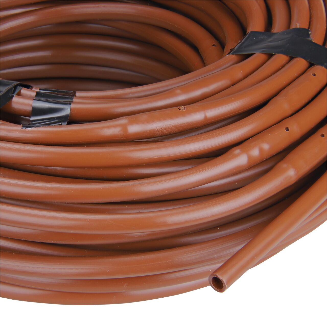 Closeup of the outside end of the NDS Brown 100 ft. 1/4 in. Dura Flo™ JR Dripline with 12 in. spaced 0.5 GPH Non-Pressure Compensating Emitters (NDS SFJR-BL-12-01)