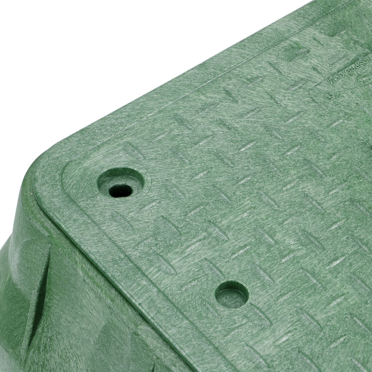 Closeup view of the bolt hole on the Green NDS 13 in. X 24 in. Rectangular Pro-Spec® Series Valve Box (NDS 322BCB) for securing valve lid or cover to the valve box