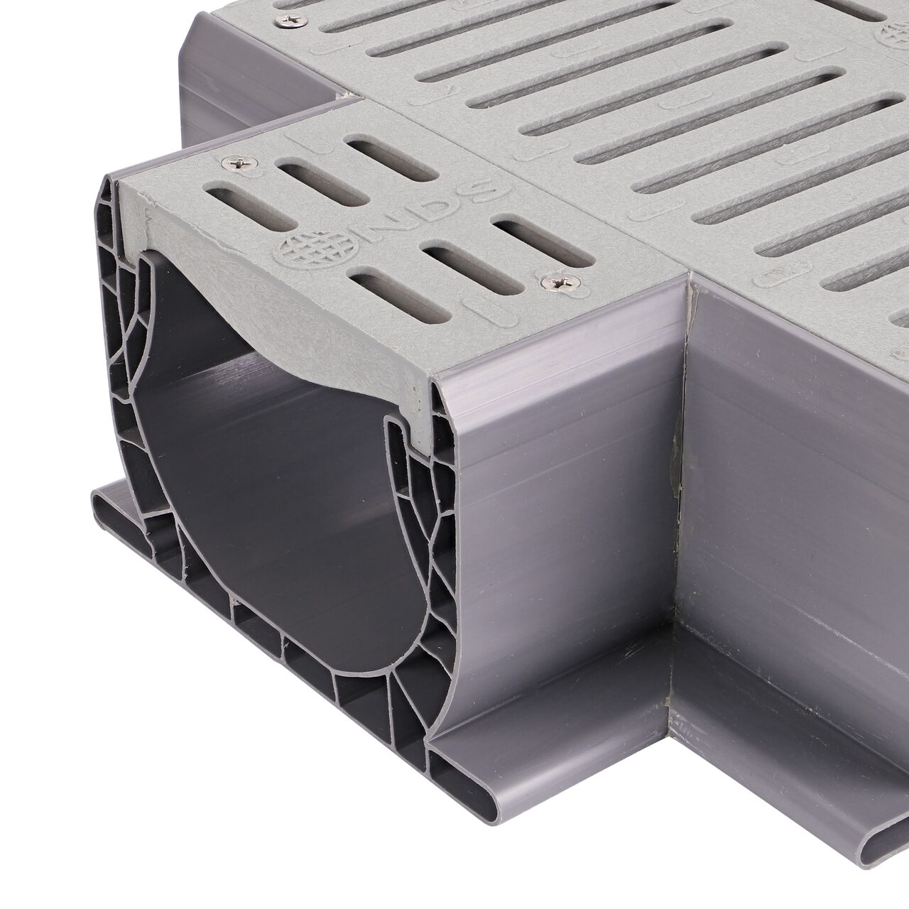 Closeup of the drain opening of the NDS Gray Spee-D® Channel Drain Cross and Grate (NDS 2361)