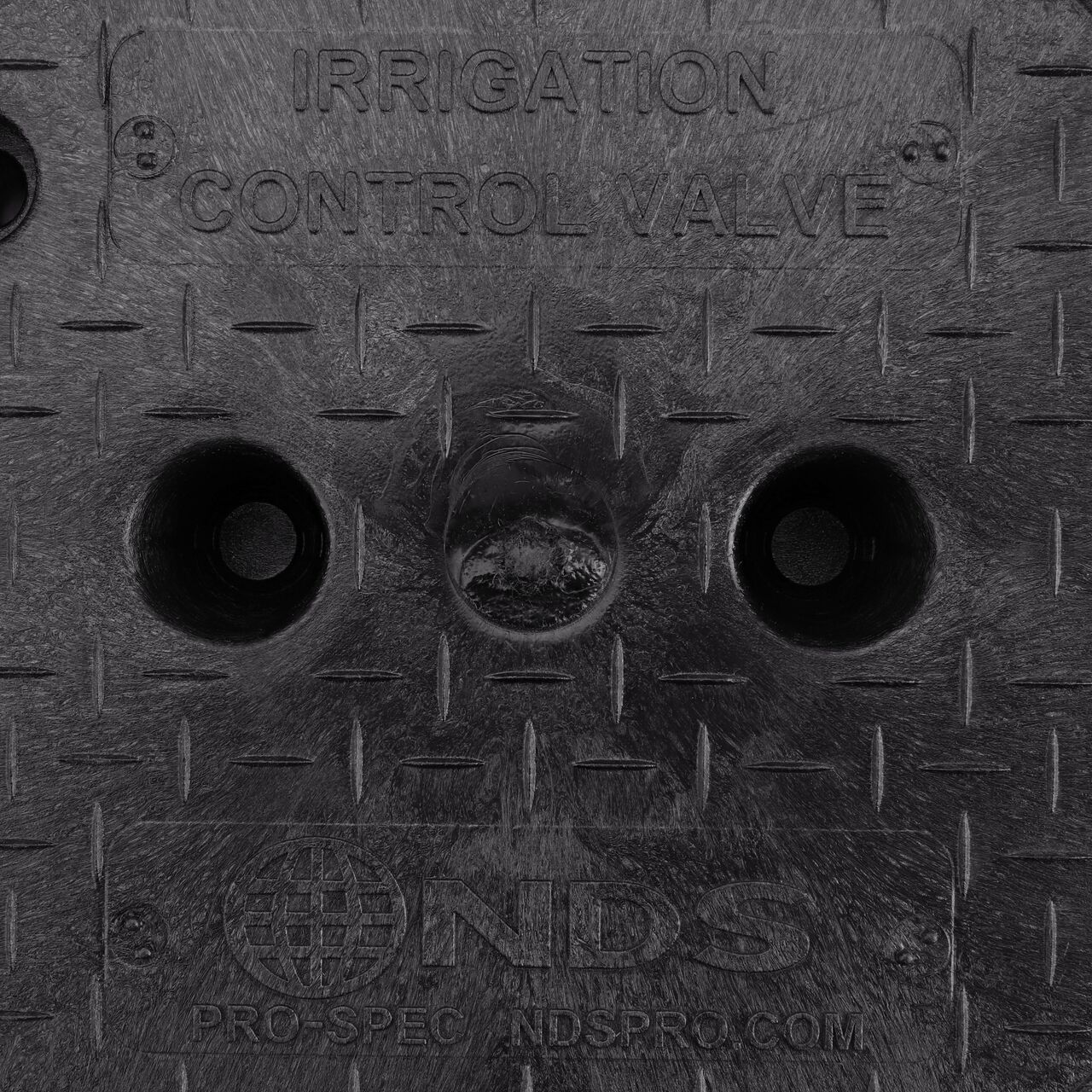 Closeup view of the Irrigation Control Valve markings on the Black Irrigation Control Valve cover for the NDS 10 in. Round Pro-Spec® Series Valve Box (NDS 311BCBBLK)