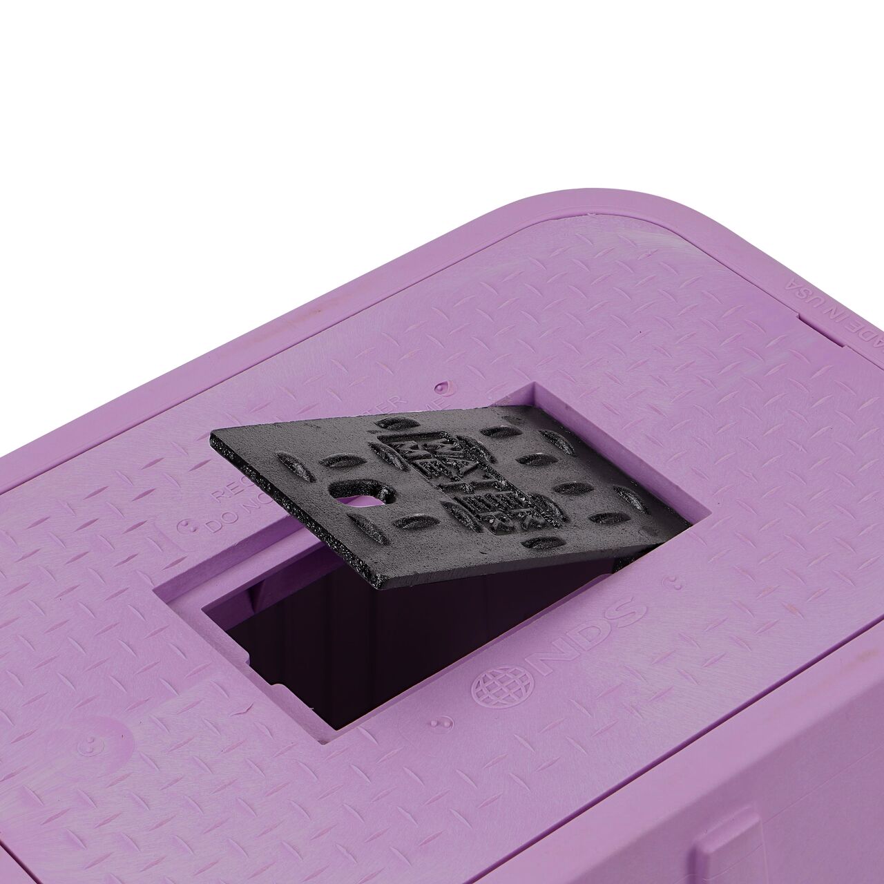 The drop-in meter box lid securely in place on the NDS 14 in. X 19 in. Rectangular Standard Series purple Meter Box and purple water meter Cover with Cast Iron reader door (NDS D1200P-DICIRP) keeping components protected against the elements, foot traffic, lawn care equipment, and potential vandalism while keeping them out of sight