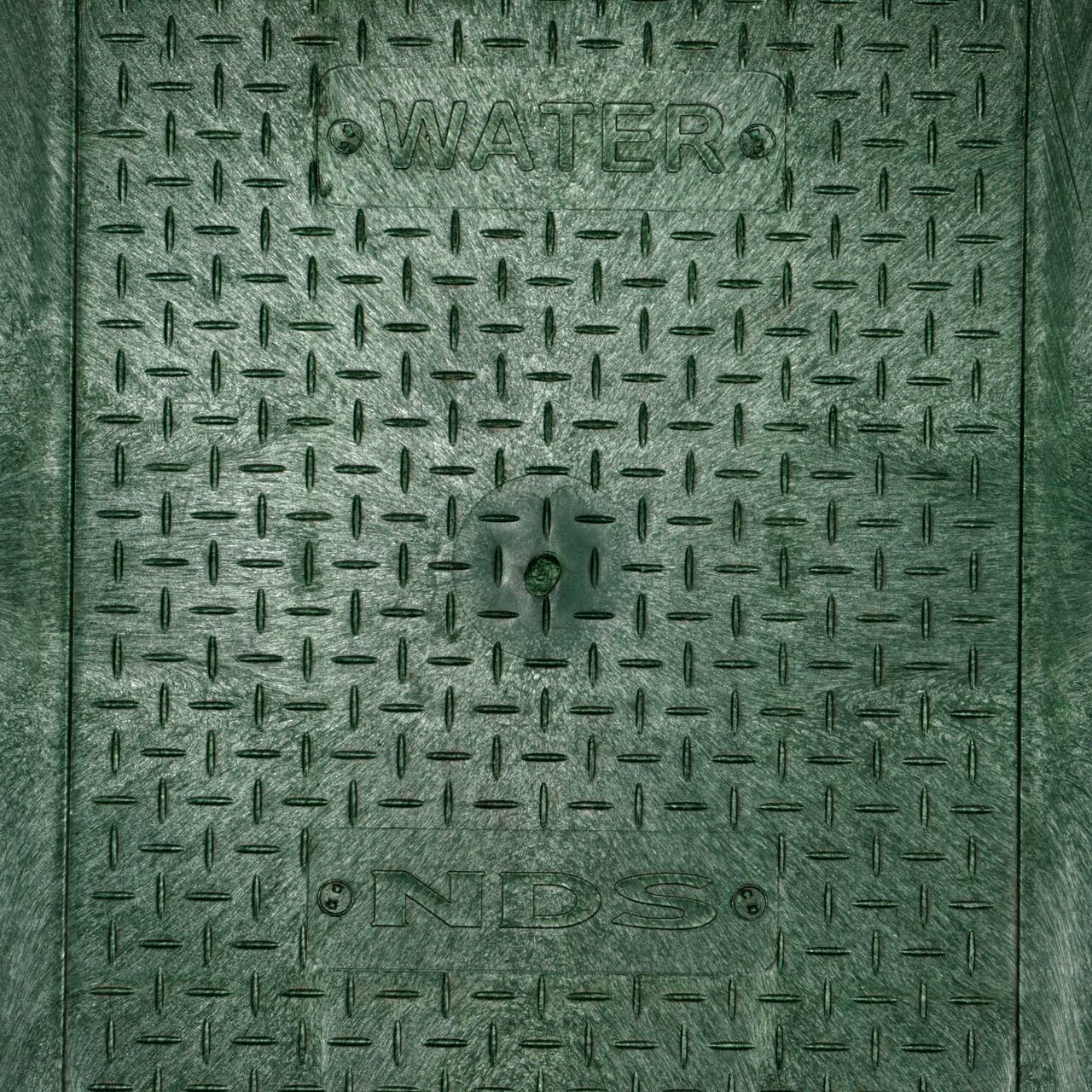Closeup view of the Water markings on the green water cover for the NDS 14 in. X 19 in. Rectangular Standard Series Valve Box (NDS 114CW)
