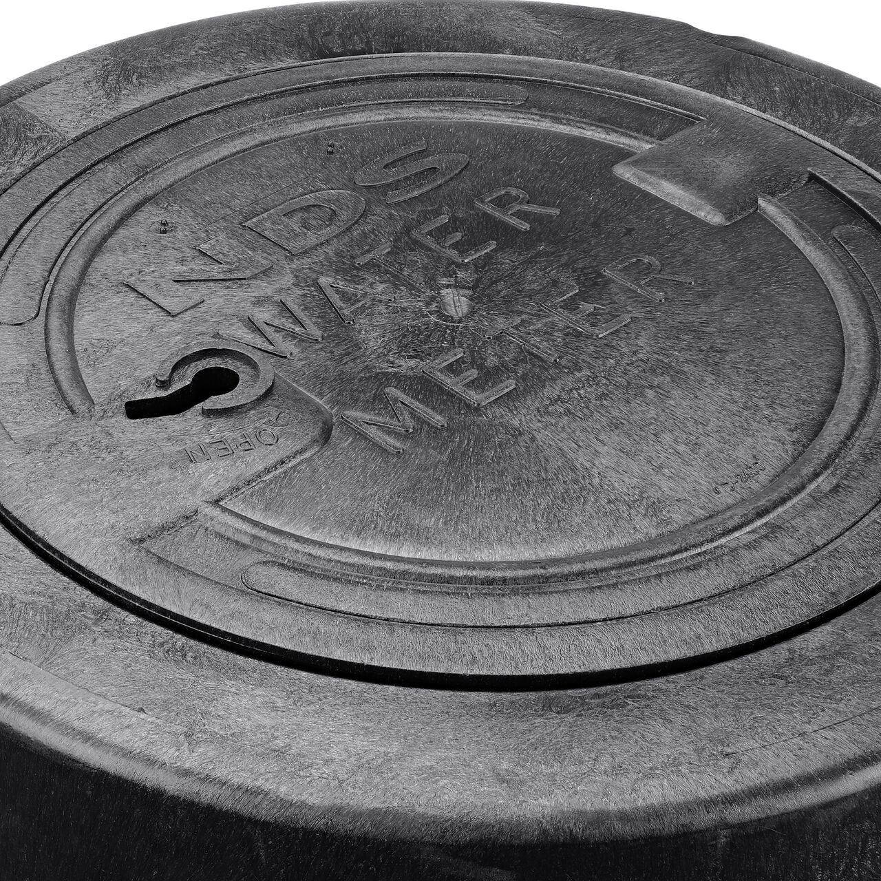Closeup view of the water meter markings on the black water meter cover for the NDS 16 in. Rectangular Standard Series Meter Pit Box (NDS D2400-18LOCSB)