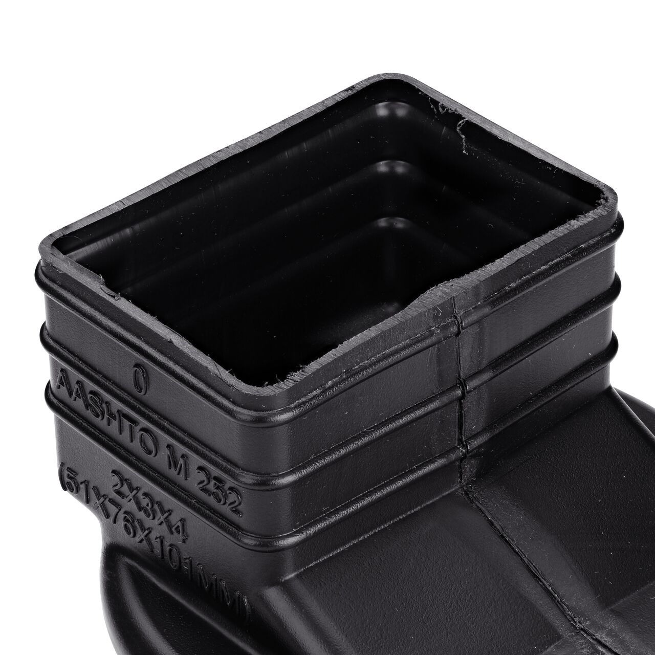 Closeup of the ridges outside of the rectangular opening of the HDPE Downspout Adapter which transitions 2X3 in. Downspout to 4 in. Hub (NDS 234CDS)