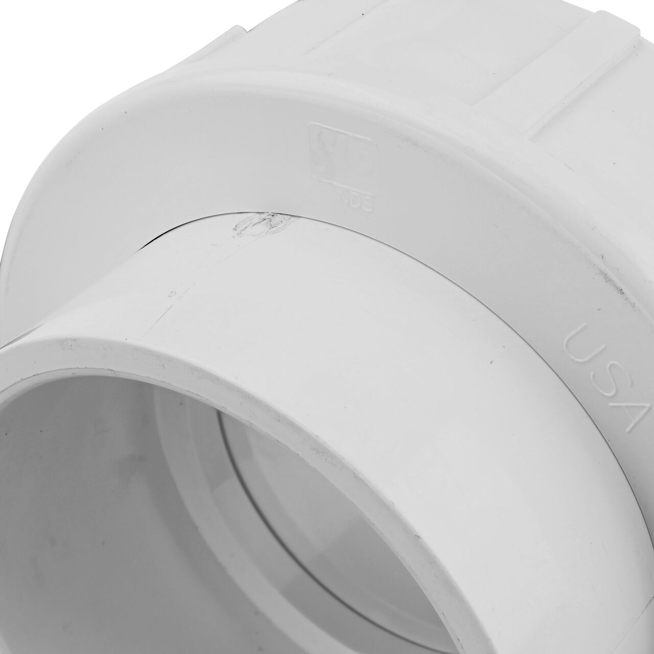 Close up view of the PVC Union, 4 in. Sch. 40 S X S showing NDS brand a leader in flow management solutions and the preferred choice of professionals since 1972 mark (NDS WU-4000-S)