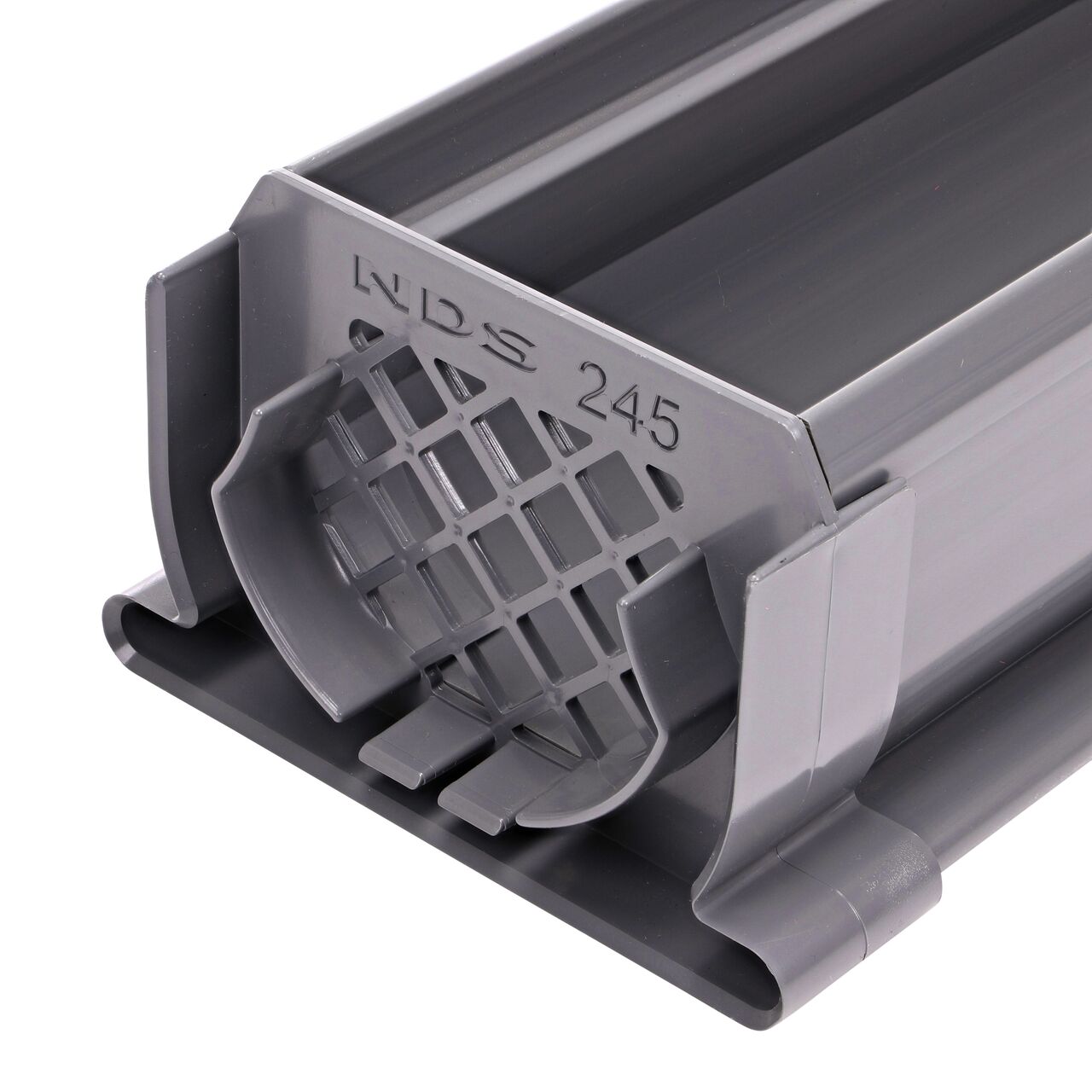 The Spee-D® Channel Drain Strainer Coupling (NDS 245) installed on end of the Spee-D Channel Drain (NDS 400, NDS 400-10)